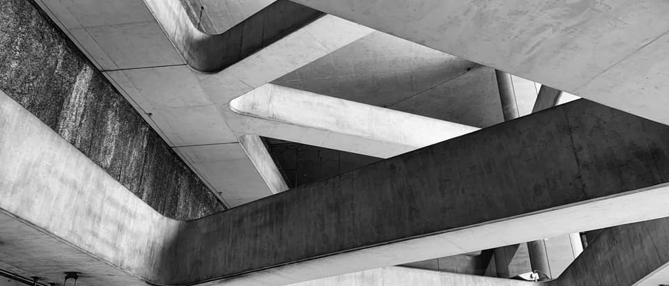 a black and white photo of a concrete structure