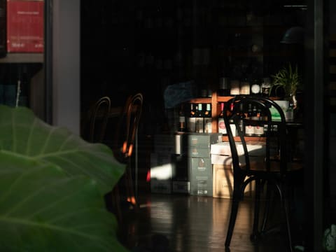 Bar & Wine Units: sunlight streams into a dimly lit cafe interior