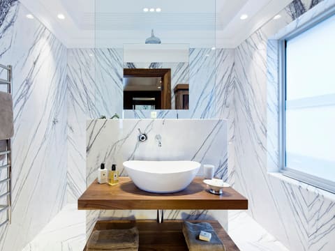 Basins: white ceramic sink on brown wooden table