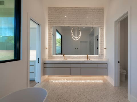 Bathroom Mirrors: elegant modern bathroom with large illuminated mirror and double vanity