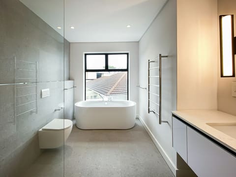 a bathroom with a tub and sink