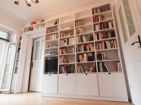 Bookshelves & Study Units: white wooden book shelves with books