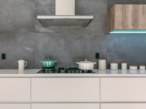 Extractor Hoods: green and white casseroles on white oven