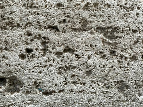 Foam Ceramics: person in blue shoes standing on white sand during daytime