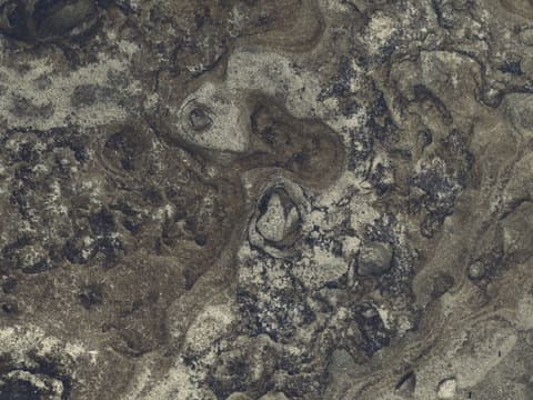 Granite: a black and white photo of rocks and water