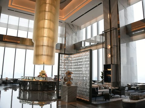 Hotel Lobby Statement Fixtures: luxurious hotel lobby with modern decor and large windows