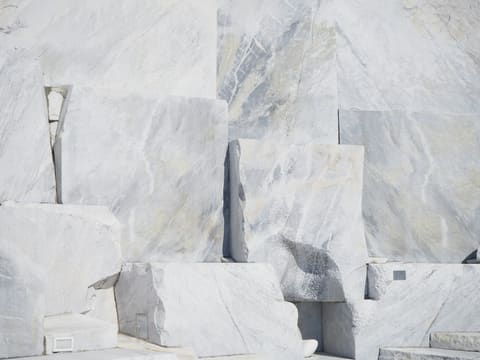 Large-Format Marble Slabs: gray rock formation during daytime