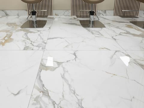 three chairs sitting on a marble floor in a room