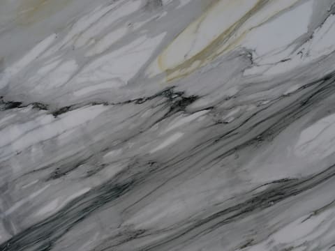 Natural Marble Slabs & Bookmatch Panels: white marble slab with grey veining and subtle golden streaks