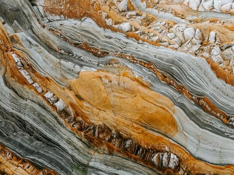 Marble Colour Ranges: close-up photography of gray and orange stones