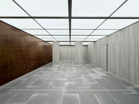 Porcelain Floor Tiles: modern empty room with illuminated ceiling and textured walls