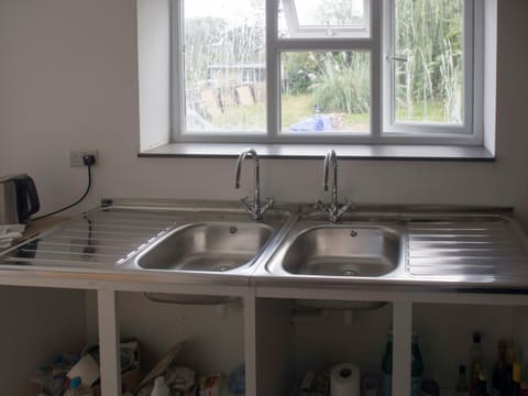 Sinks: a kitchen with a sink and a window