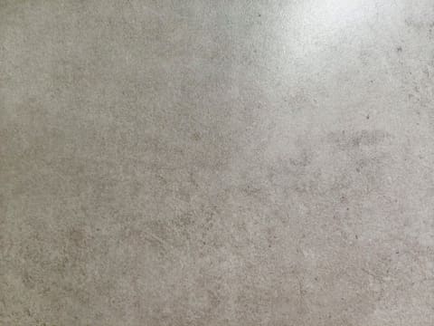 Sintered Stone: a textured concrete surface with subtle variations