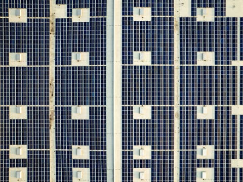 Solar PV & Inverters: a large array of blue and white tiles