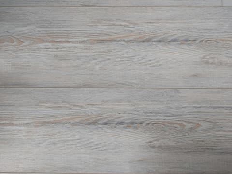 SPC / LVT Vinyl Plank: a close up of a wooden floor with white paint
