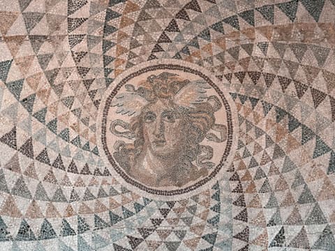 Stone Mosaic & Waterjet Medallions: a close up of a mosaic on a wall