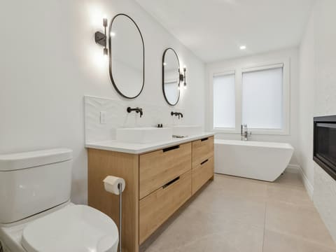 Toilets: white ceramic sink with stainless steel faucet