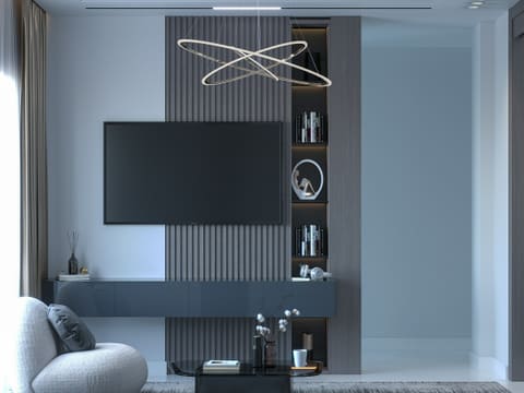 TV & Media Walls: a room with a tv and a shelf with books