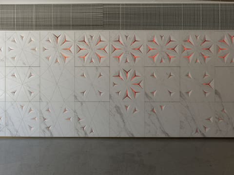A white wall with a pattern on it