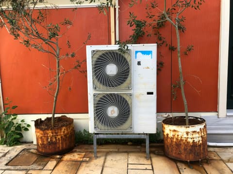 Water Heaters & Heat Pumps: a white and black heater